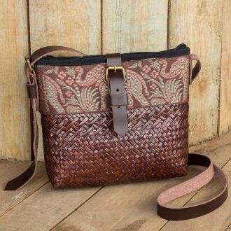 Hand Woven Sedge Shoulder Bag with Leather Accents, 'Thai Elephant Parade on Brown'