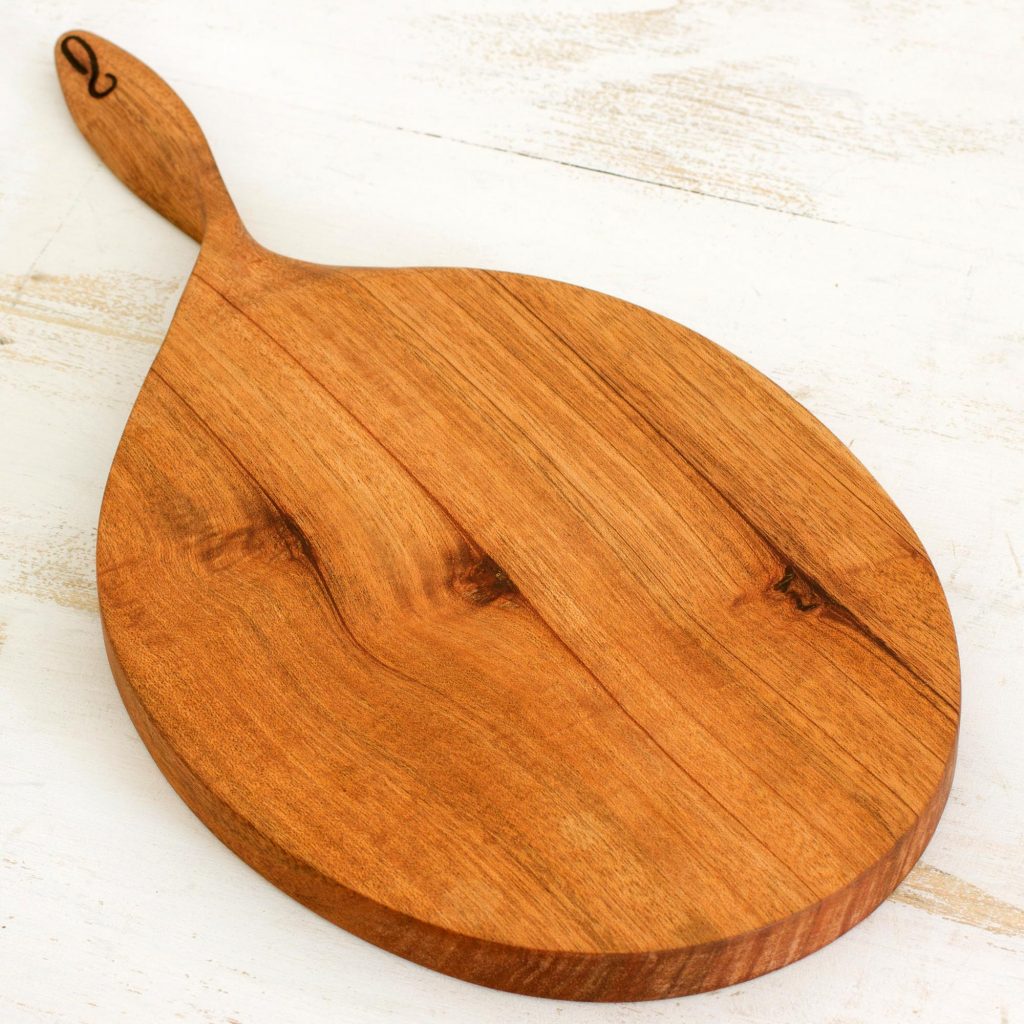 Hand Carved Cutting Board Natural Wood Color from Nicaragua, 'Twist of Nature'